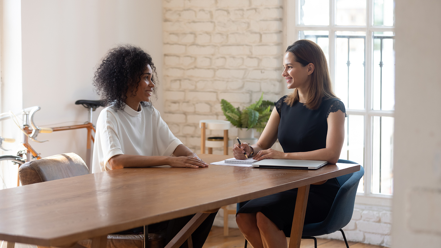 Happy Businesswoman Hr Manager Holding Interview With Job Applicant